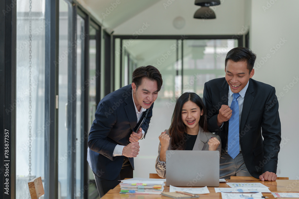 Great job! Successful business team is clapping their hands in modern workstation, celebrating the performance of new product Great job! Successful business team is clapping their hands in modern workstation, celebrating the performance of new product