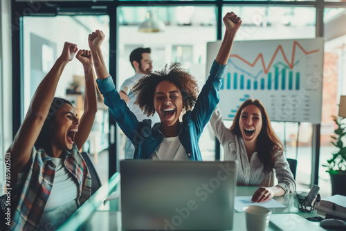 Joyful team celebrates a successful achievement in the office, with hands raised in victory. Employees celebrates their success, acheive target concept photo