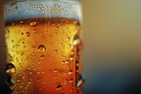 Beer in a glass with water droplets on a blurred background