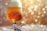 Glass of beer with foam on bokeh background, closeup