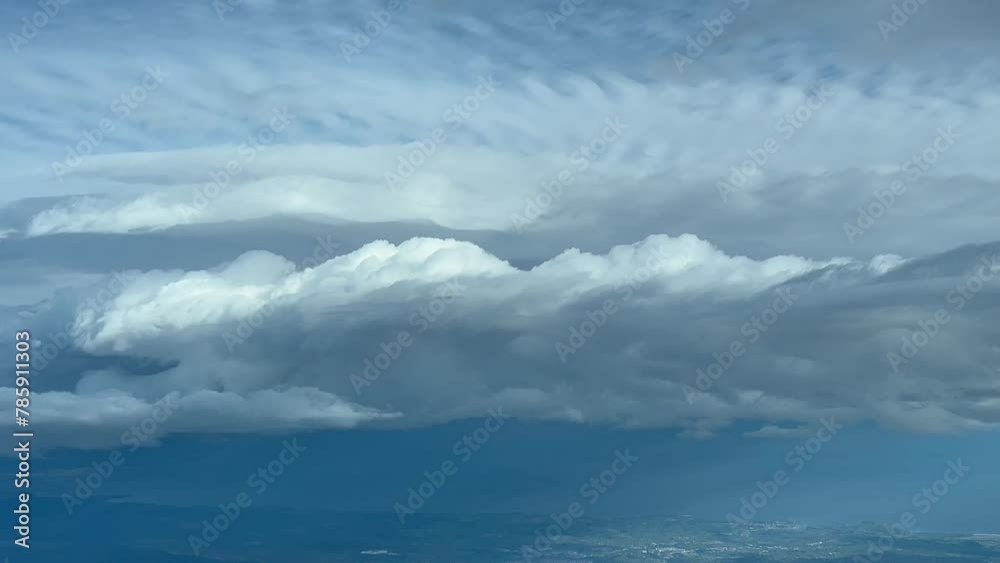 Exclusive shot from a plane cockpit while flying near a huge stormy cumuloninbus cloud. Immersive Pilot POV. Daylight, blue sky. 4K 60FPS Exclusive shot from a plane cockpit while flying near a huge stormy cumuloninbus cloud. Immersive Pilot POV. Daylight, blue sky. 4K 60FPS