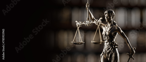 Legal Concept: Themis is the goddess of justice as a symbol of law and order on the background of books photo