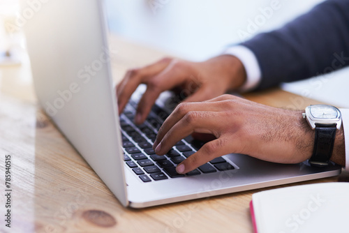 Hands, laptop keyboard and desk for typing email, online research and business communication. Fingers zoom, corporate job and tech on table for writing article, internet connectivity and web browsing