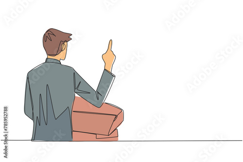 Single one line drawing from back view young businessman speak at podium while lifting index finger. Businessman in Conference Hall present new business. Continuous line design graphic illustration