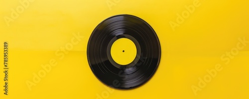 classic vinyl record against a solid bright yellow background, evoking a retro yet modern feel. © amazingfotommm