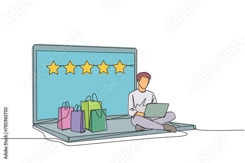 Single continuous line drawing happy man sitting on giant laptop typing on laptop computer. Bought a lot from online shop. Give a rating of 5 stars. Ecommerce. One line design vector illustration