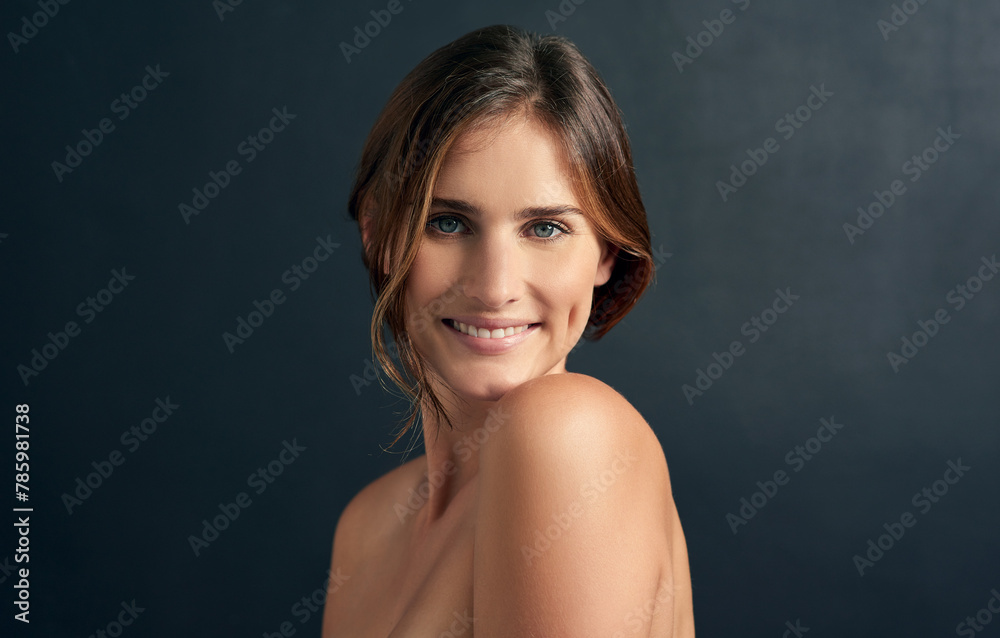 Woman, topless and portrait in studio for skincare, body positivity and acceptance on dark background. Young person, smile and natural beauty for smooth aesthetic and fresh for confidence and happy Woman, topless and portrait in studio for skincare, body positivity and acceptance on dark background. Young person, smile and natural beauty for smooth aesthetic and fresh for confidence and happy