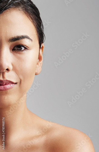 Woman, portrait and beauty with skincare at salon for haircare, cosmetics or makeup on a gray studio background. Face of young female person or model for hygiene or facial treatment on mockup space