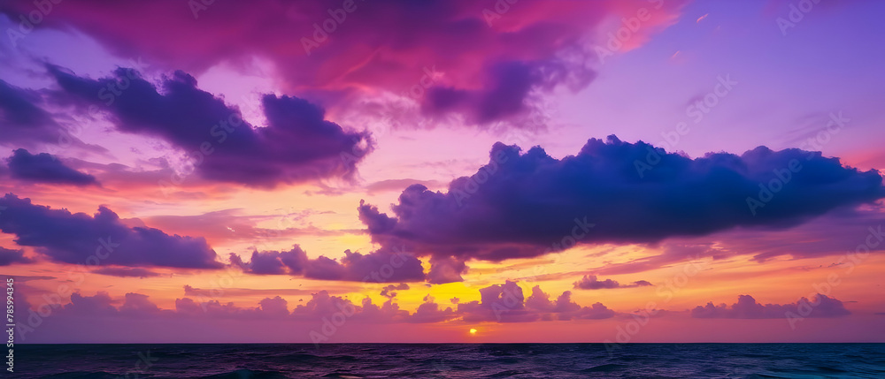 Panorama of Beautiful view sunset sky over sea, Colorful dramatic majestic scenery sunset Sky with Amazing clouds and waves in sunset sky purple light cloud background