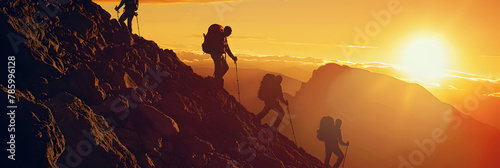  Four hikers on a mountaintop at sunrise The view is breathtaking The hikers are tired but happy They have reached their goal , A hiker helping a friend overcome the challenges on their mountain climb photo