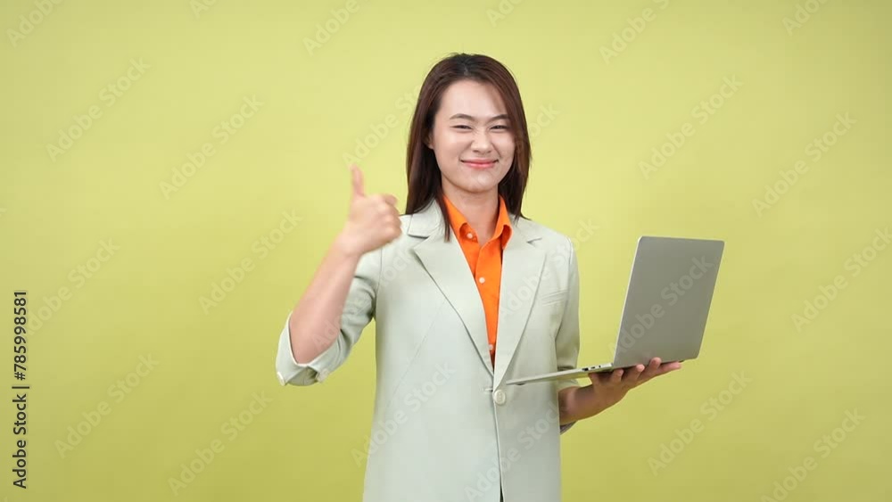 Young Asian businesswoman on green background Young Asian businesswoman on green background