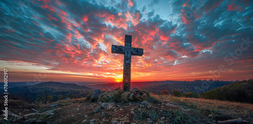 Sunset sky with christian cross silhouette