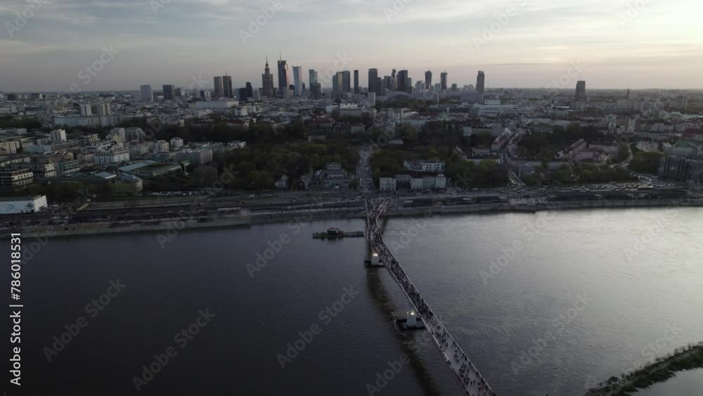 Aerial View Of People Crossing The Agrafka Bridge Over The Vistula River In Warsaw, Poland. Aerial View Of People Crossing The Agrafka Bridge Over The Vistula River In Warsaw, Poland.