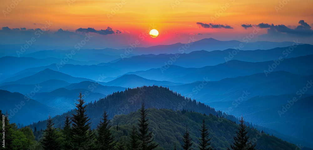 A beautiful mountain range with a bright orange sun in the sky