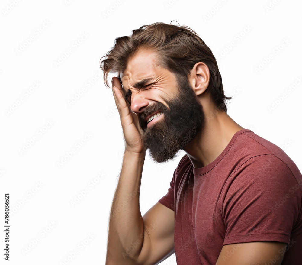A man with a beard is crying and rubbing his face A man with a beard is crying and rubbing his face