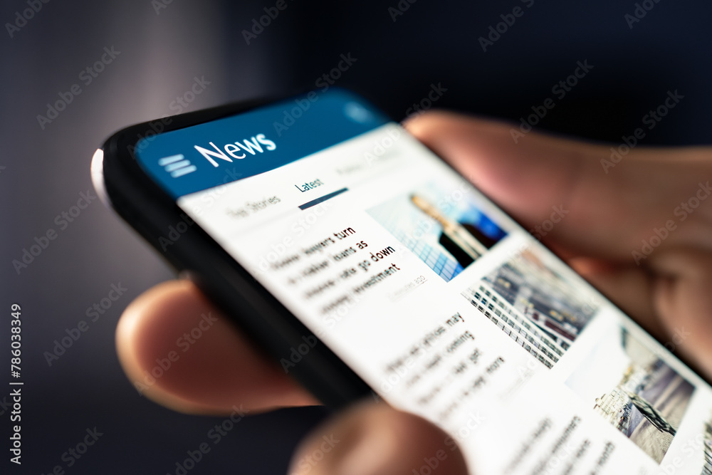 News online. Phone with newspaper headlines and feed. Digital press article. Reader watching latest titles. Mockup media publication website in smartphone. Man reading text on mobile screen. - obrazy, fototapety, plakaty 