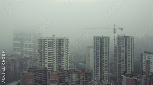 Aerial view urban cityscape with thick pm 2.5 pollution smog fog covering city high-rise buildings