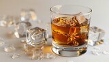 Whiskey glass with ice cubes on neutral background, perfect for adding text or captions