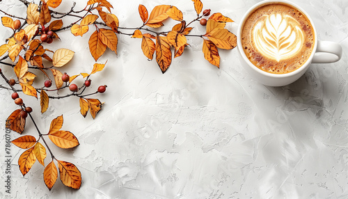 Autumn-themed flat lay with a cup of latte art coffee beside golden-hued leaves and berries on a textured white surface, Concept of fall warmth and cozy moments