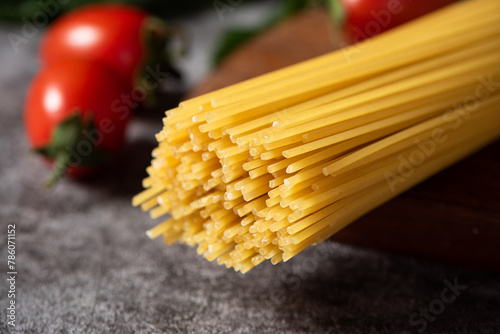 close up of raw dry spaghetti italian pasta on table.