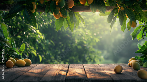 Copy space of wood branch with green leaves and Mango fruit tree, Empty table, Podium and product stand for Mango tropical fruit product and Juice concept. © Wasin Arsasoi