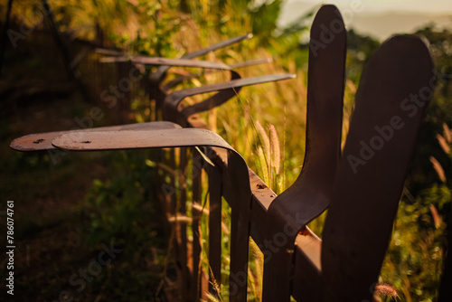 The iron fence was badly damaged due to vandalism. Selective focus and close up image.