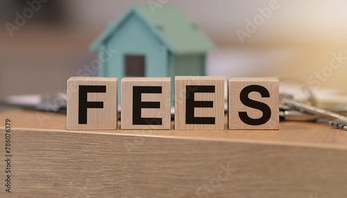 Real estate fees concept with house model