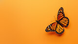 A vibrant monarch butterfly with its wings fully spread on a yellow background, symbolizing hope and endurance