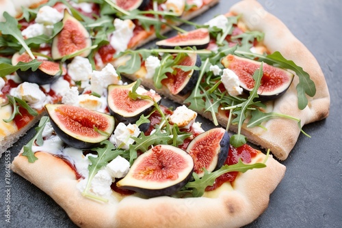 Fall flatbread pizza with fresh figs, arugula and goat cheese