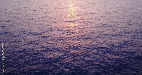 Rays of the setting sun over the ocean water in the Maldives
