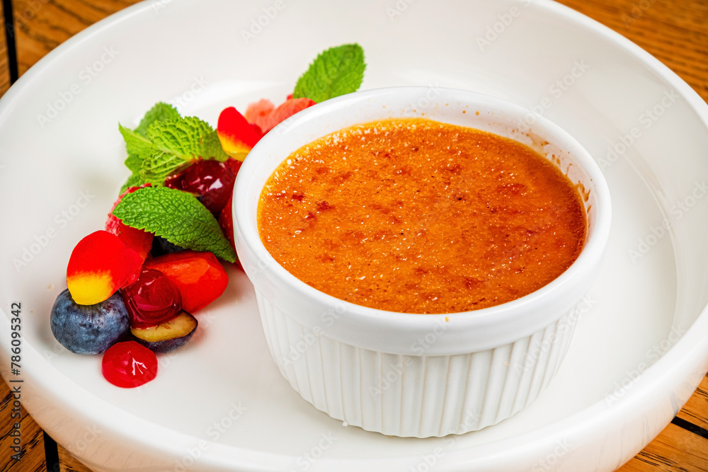 Creme brulee with strawberry and blackberry