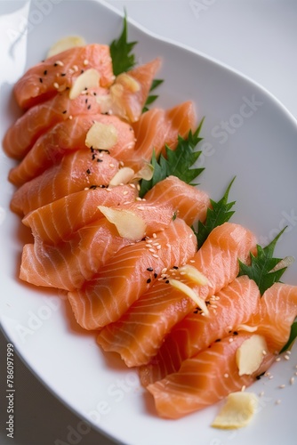 Salmon sashimi with ginger and sesame seeds