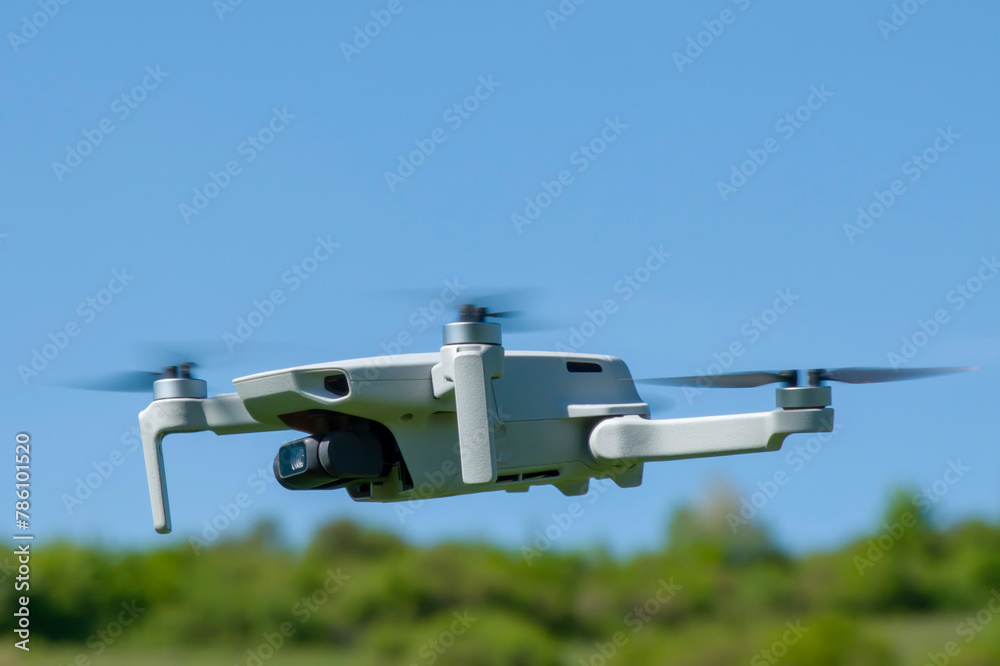Remotely controlled drone with camera system in full operation Remotely controlled drone with camera system in full operation