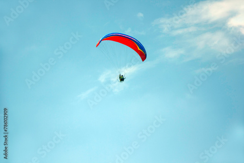 paratroopers streak across the sky