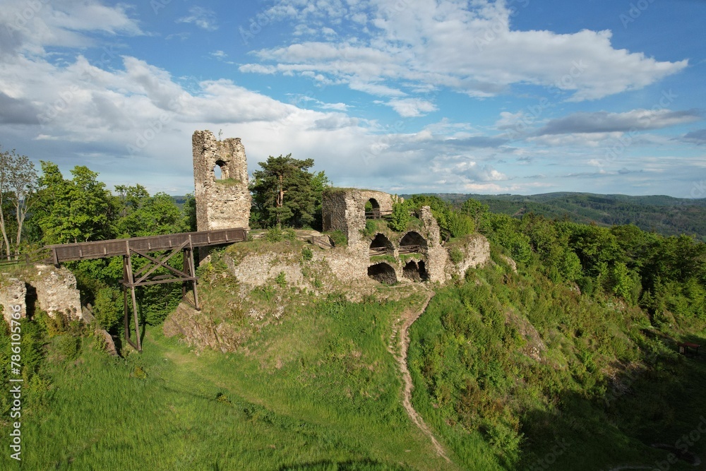 Ruins of the big castle Zubstein with a cloudy blue sky in the background, in the Czech Republic