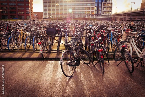 Closeup shot of bunch of bicycles parked in a main station of Amsterdam, Netherlands photo