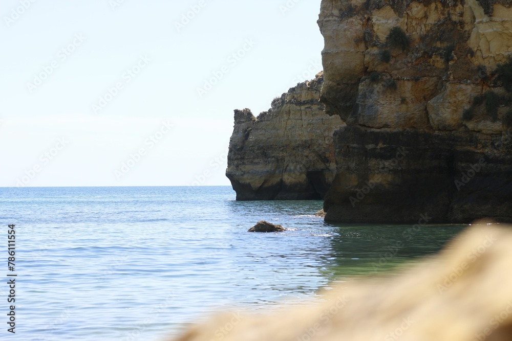 Scenic view of coastal cliffs seen in the countryside on a sunny day