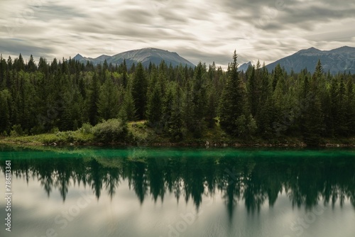 Green Lake with trees and mountains in the valley of the five lakes in Alberta, Canada