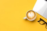 a white cup of coffee and black glasses on an orange background