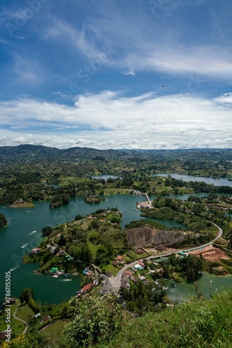Vertical aerial view of a landscape with lakes and lush vegetation in Guatape © Wirestock