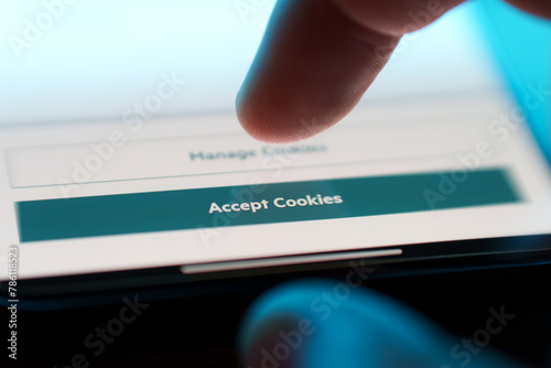 Accept cookies button on internet webpage on smartphone. Internet browsing history data technology security concept