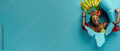 Energetic woman dressed in festive carnival costume bursting through blue paper background Ideal for themes of joy and vibrant celebrations photo