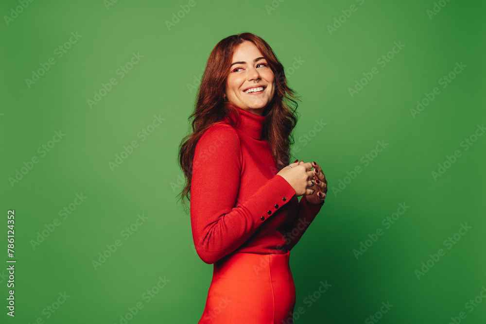 Happy woman with trendy style against green background - obrazy, fototapety, plakaty 