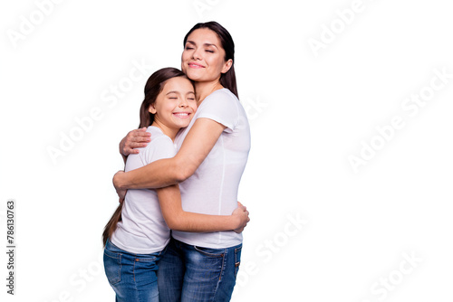 Close up photo adorable amazing pretty two people brown haired mum small little daughter stand close eyes closed holding hands arms circle wearing white t-shirts isolated on bright blue background © deagreez
