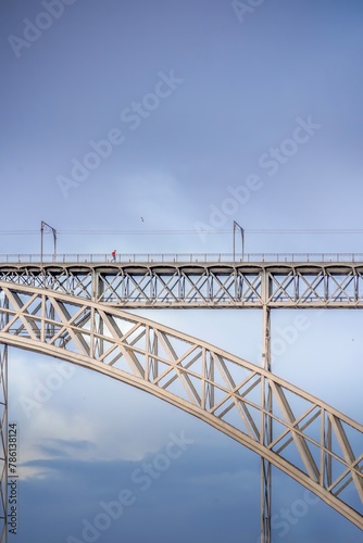 Frontal view from the river of the steel bridge Don Luis I. Douro river in Porto. Lisbon. © ikuday