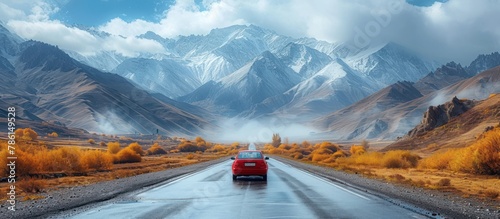 car traveling on mountain road. background of mountains against blue Sky