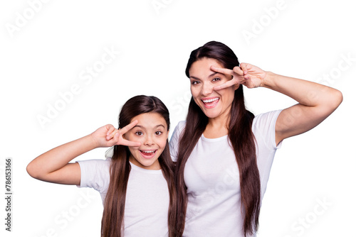 Close up photo cheer two people brown haired mum small little daughter hands arms fingers show v-sign say hi yell delighted amazed wear white t-shirts isolated bright blue background