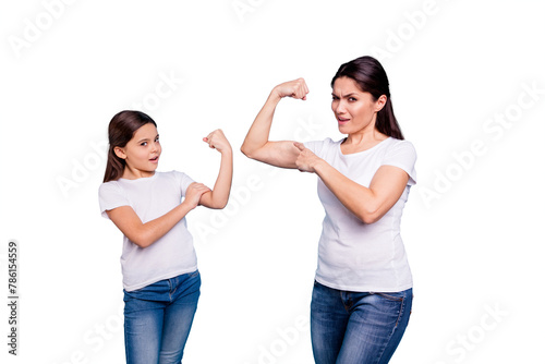 Close up photo I can do it two people brown haired mum mom small little daughter hand on biceps show how powerful girls are wear white t-shirts isolated bright blue background