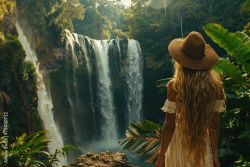 Woman Standing in Front of a Waterfall photo