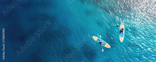Arial view of the paddleboard on the very beautiful and clear sea.